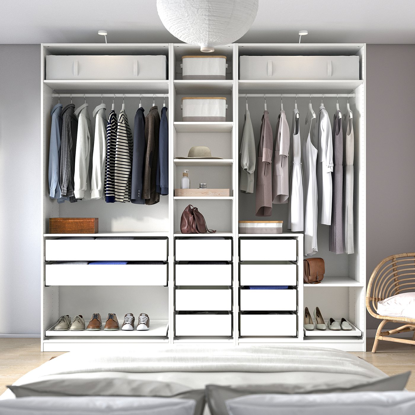 Modern bedroom with large, organised white wardrobe.