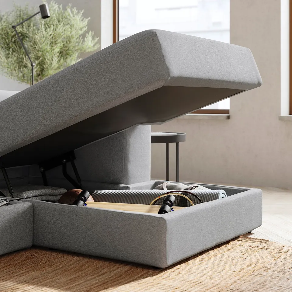 Modern grey fabric sofa with storage. Clean lines, soft comfort, and practical design.