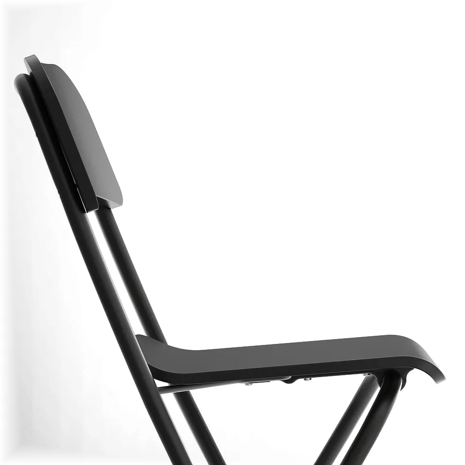 Black bar stool with backrest and footrest, designed for stability and comfort. A safety lock mechanism.