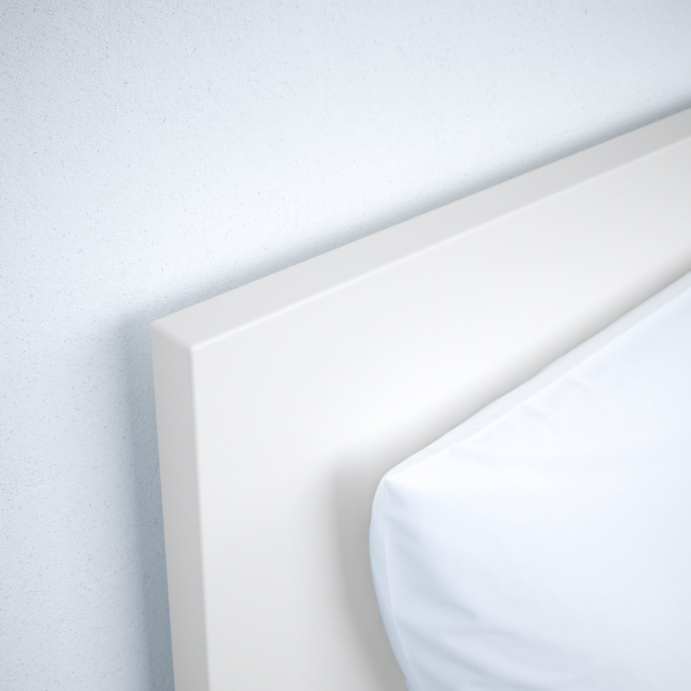Modern, clean-lined white bed frame with smooth edges, part of a sleek, minimalist bedroom setup.
