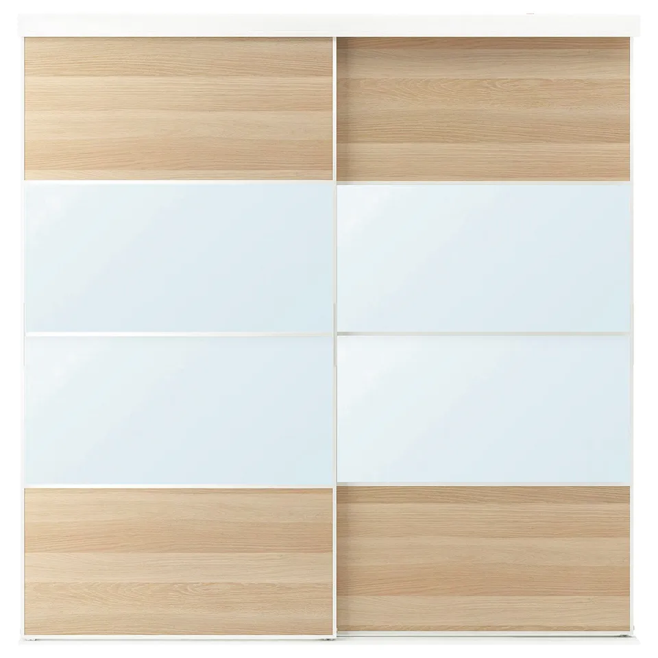 A SKYTTA sliding closet door in light wood and white. It sleek, modern design with mirror panels and wooden accents.