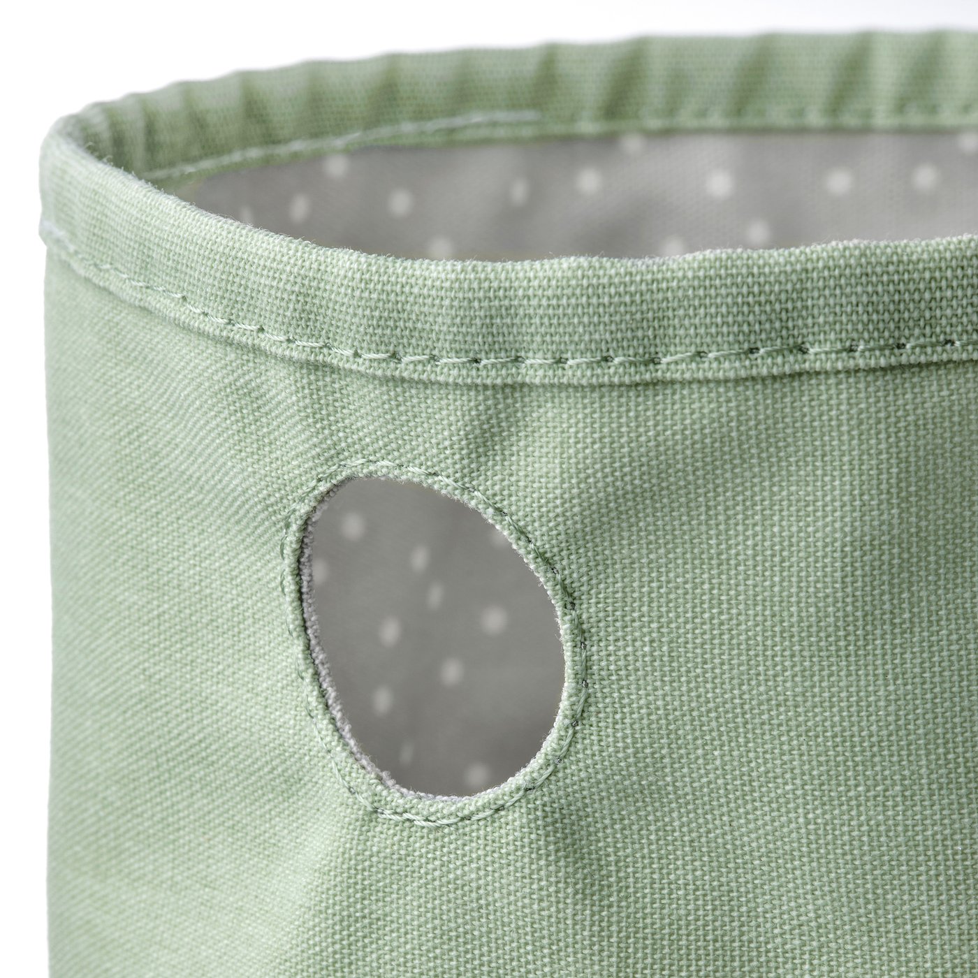 Green round storage bag with grey dotted lining.