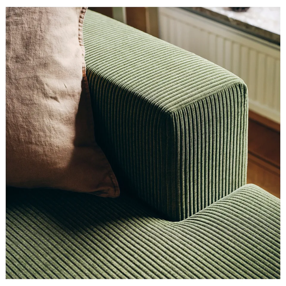 Green JÄTTEBO sofa, textured corduroy, rectangular shape, comfy cushions, cosy home decor.
