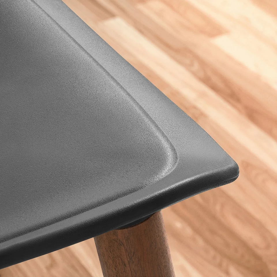 Altar-like table with smooth, rounded edges resting on sturdy wooden legs, showcasing craftsmanship and durability.