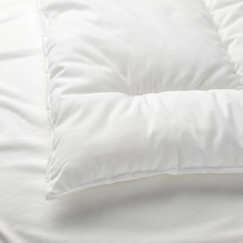 Soft, plush pillow for baby, made with recycled polyester and cotton.