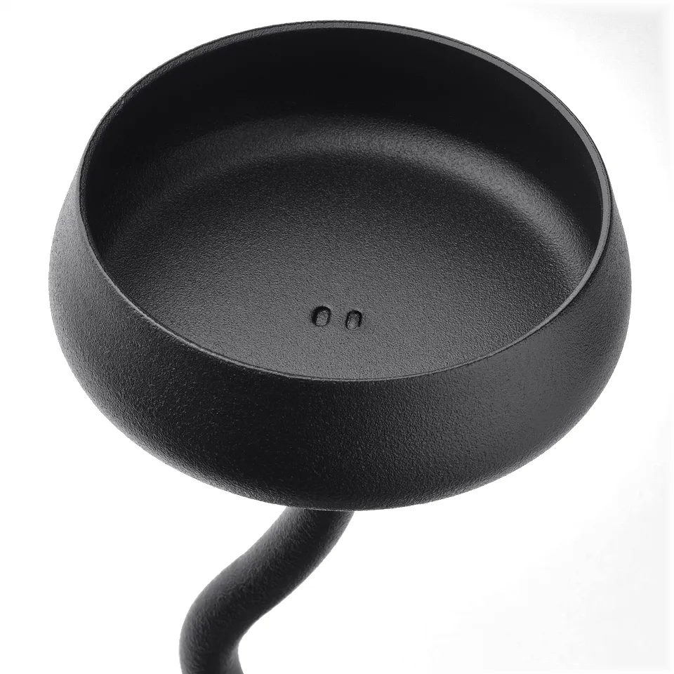 Black, sleek candlestick with smooth, rounded bowl top, elevated on gently curving stem.