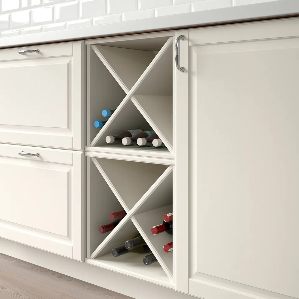 White kitchen cabinet with wine rack, holding bottles, integrated into cabinetry.