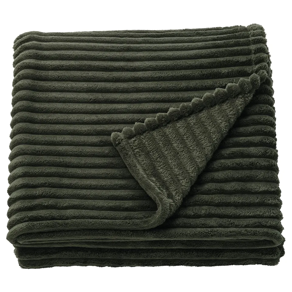 Green GULLSTRÅLE folded blanket with textured stripes.