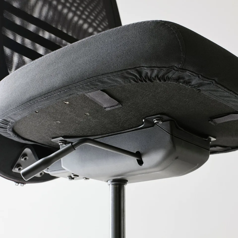 Ergonomic chair detail: durable mesh back, adjustable seat, metal base.