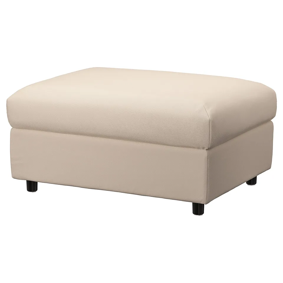 A VIMLE beige footstool with storage, featuring a rectangular shape and sturdy wooden legs.