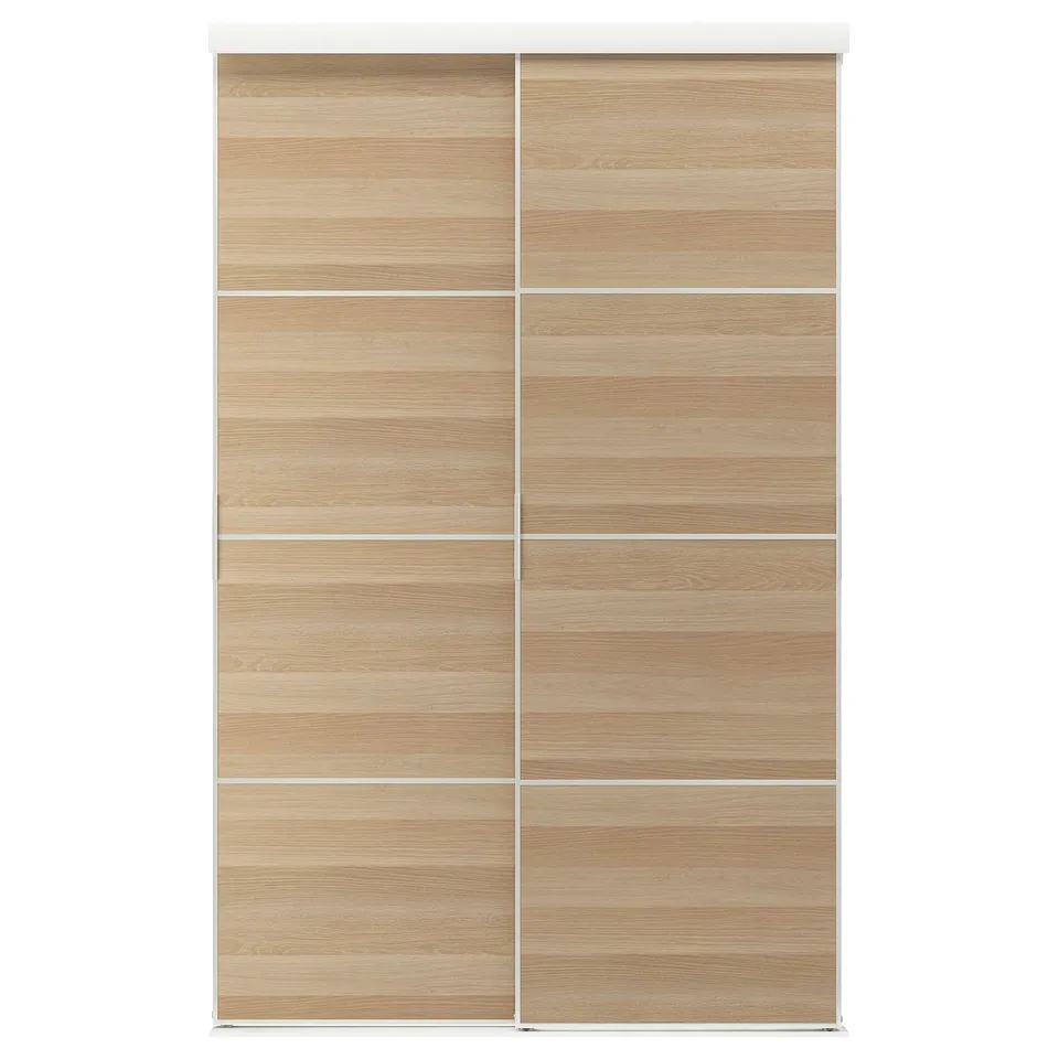 A light wooden SKYTTA sliding closet door with minimalist style.