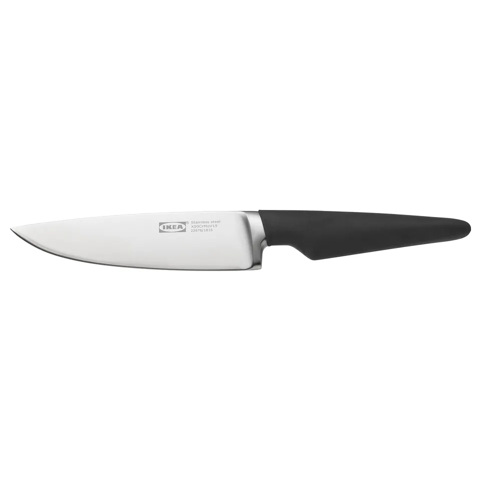 An ikea VÖRDA knife with a black handle and silver blade. The knife has a sleek design and is suitable for slicing and trimming.