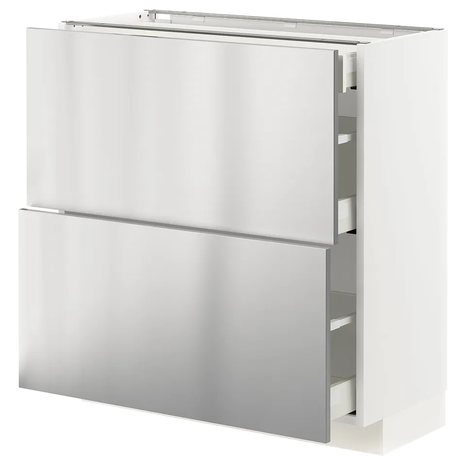 A white METOD kitchen cabinet with stainless steel doors and drawers. It has a sleek, modern design.
