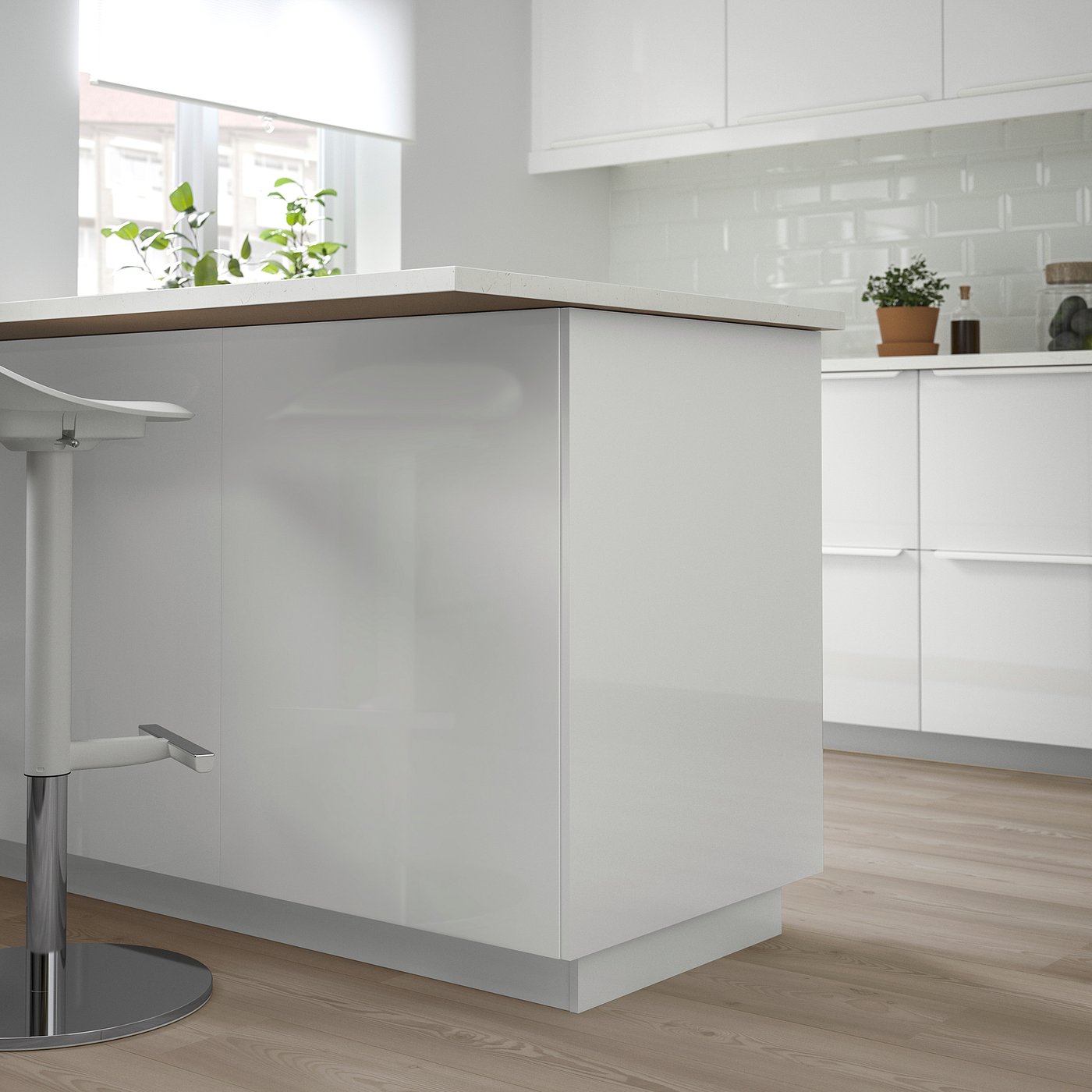 Modern white kitchen island with glossy finish, sleek design, large and spacious, surrounded by wooden floors and white cabinetry.