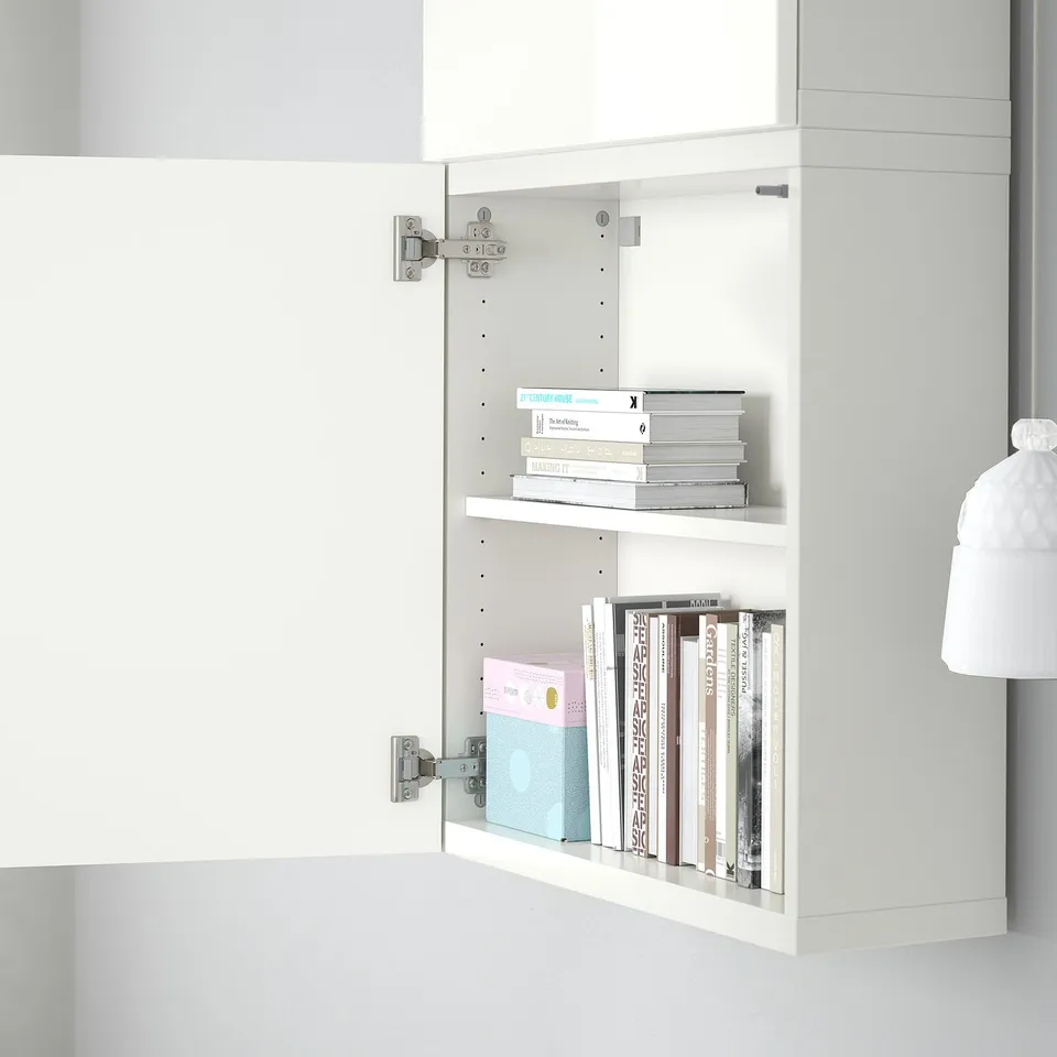 Open BESTÅ shelf displaying books on two white shelves.