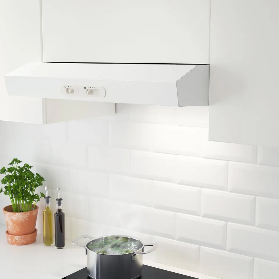 Modern white kitchen hood with led light, three-speed control, and adjustable settings for ducted or recirculation modes.