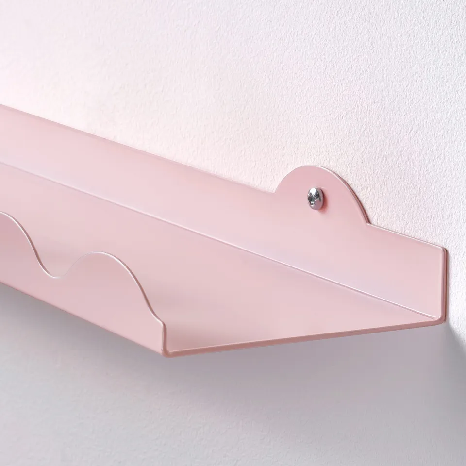 Light pink wall shelf, sturdy and elegant, mounted on a white wall.