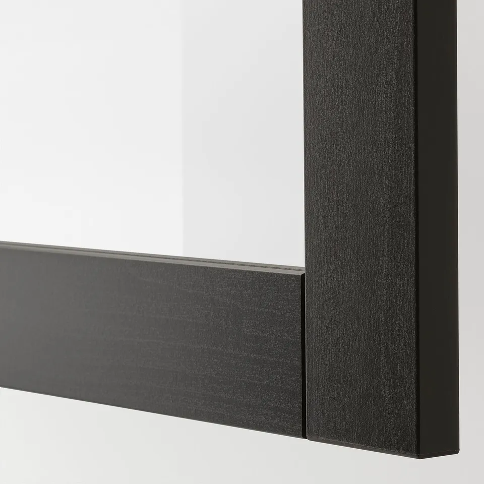 Black framed mirror with sleek, modern design. Shows high-quality craftsmanship and minimalistic style.