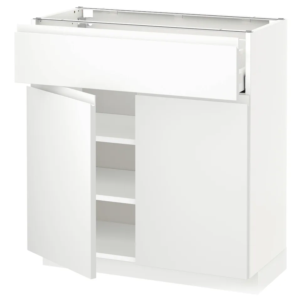 White modern kitchen unit with drawer and shelves.