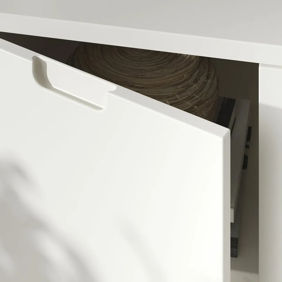 White TONSTAD tv bench corner with open cable hole.
