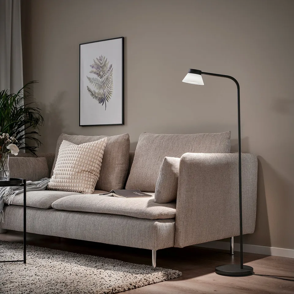 Modern living room with grey SAMBORD floor lamp beside sofa.