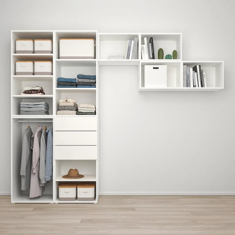 Organised closet with shelves, hanging space, and storage bins, neatly arranged.
