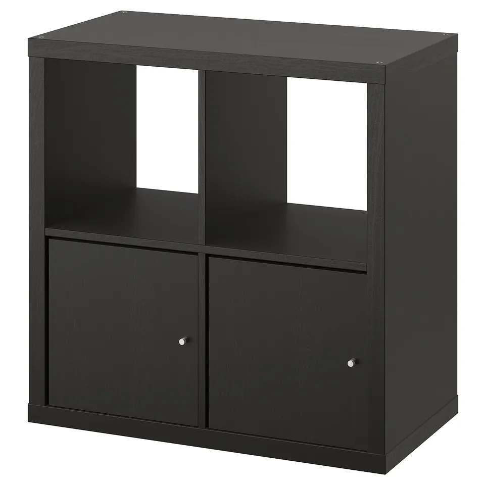 Black KALLAX storage unit, square-shaped with open and closed sections, made of particleboard and fibreboard.