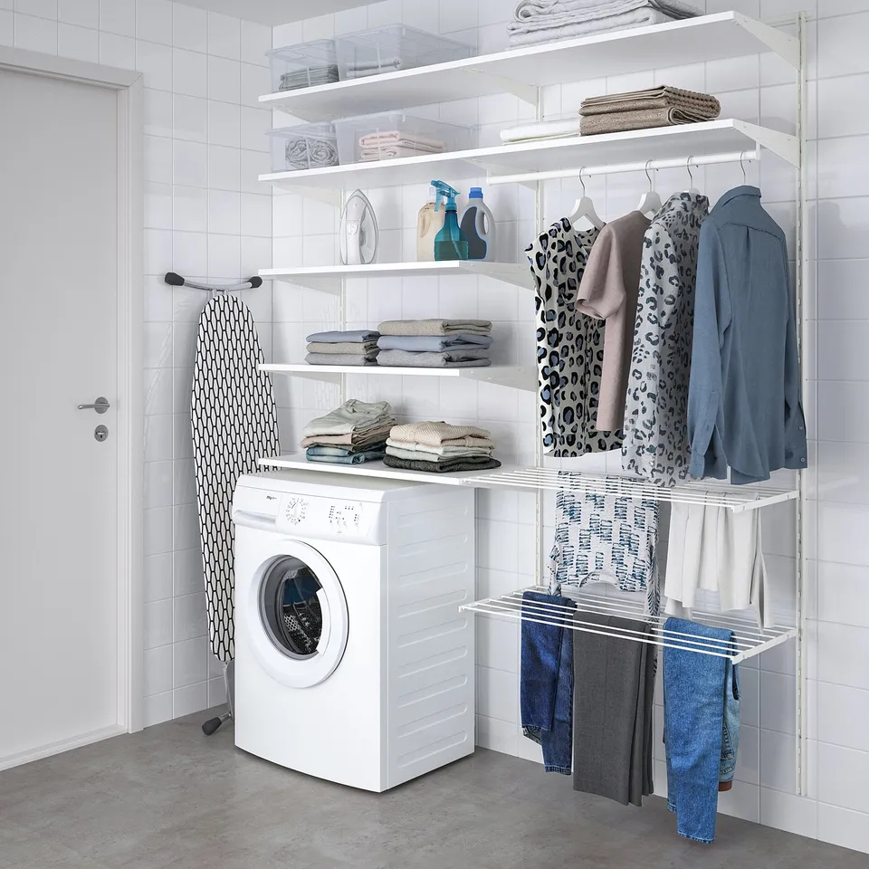 BOAXEL wall storage in laundry room with shelves, drying rack, and clothes.