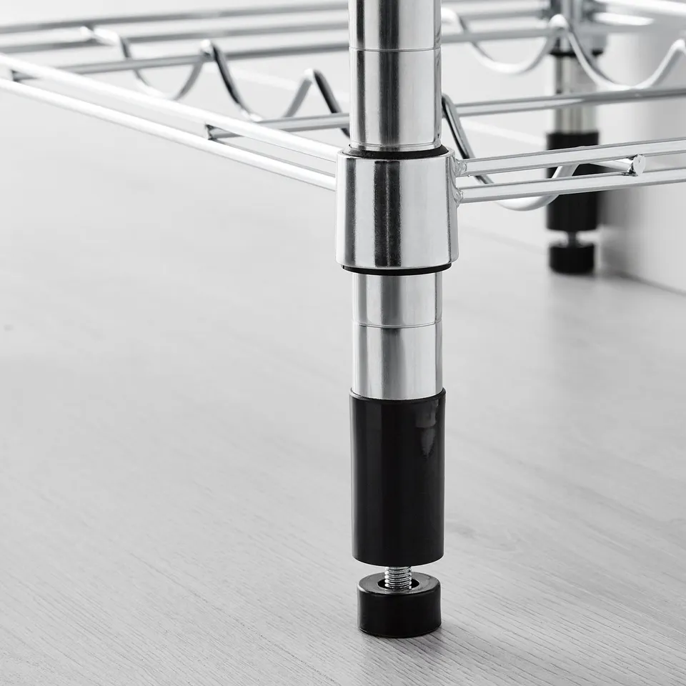 Close-up of metal shelving units adjustable leg with black foot, ensuring stability.