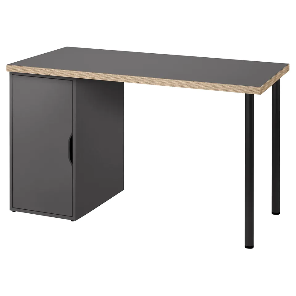 A LAGKAPTEN desk in dark grey with a honeycomb-patterned edge and black metal legs. It has a cabinet for storage.