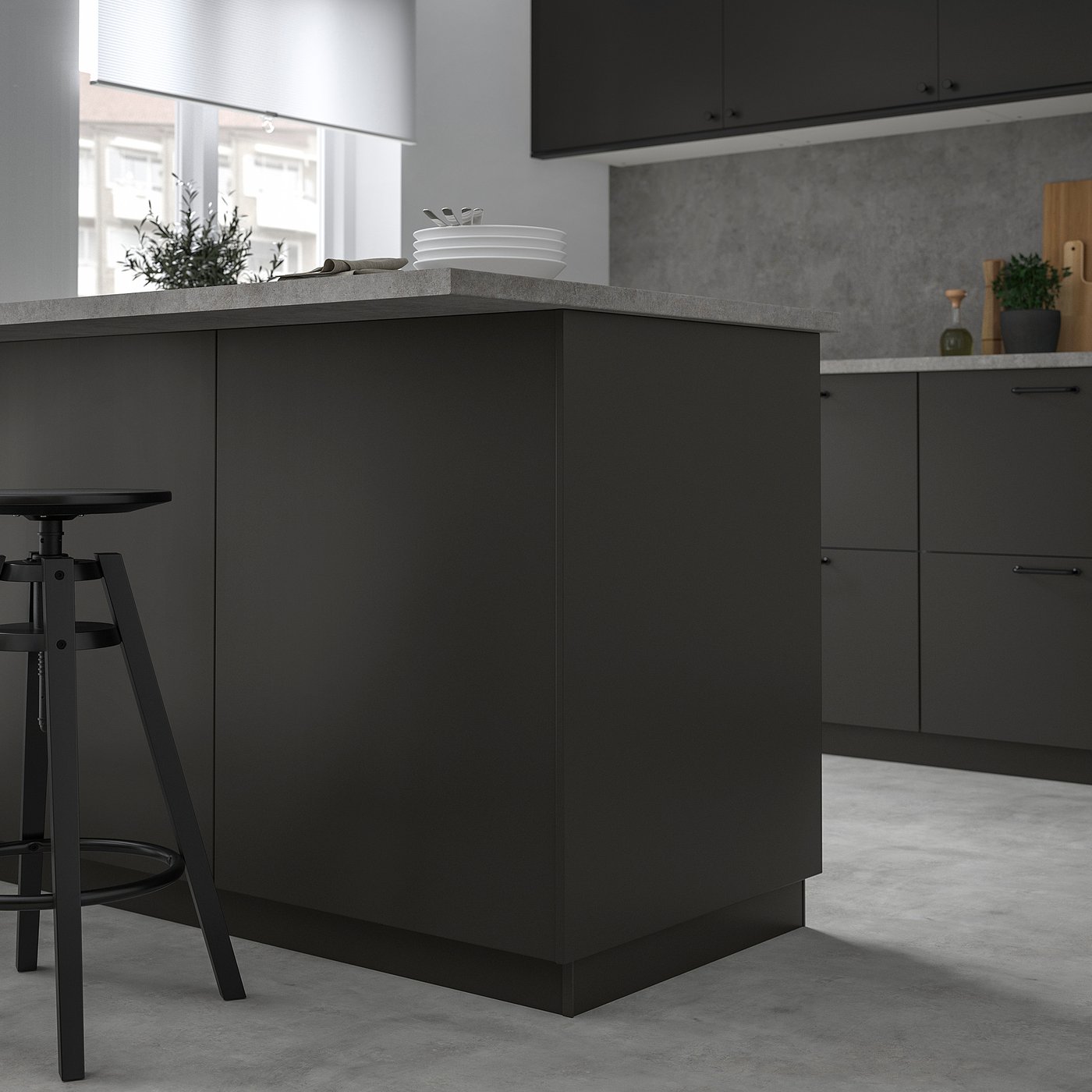 Modern matt black kitchen island with FÖRBÄTTRA panel, sleek design.