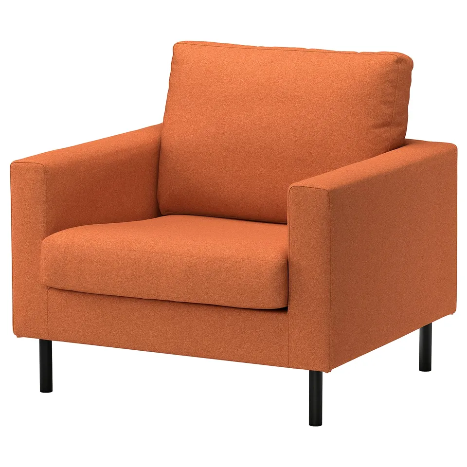 Orange upholstered chair, square design, soft cushions, black legs.
