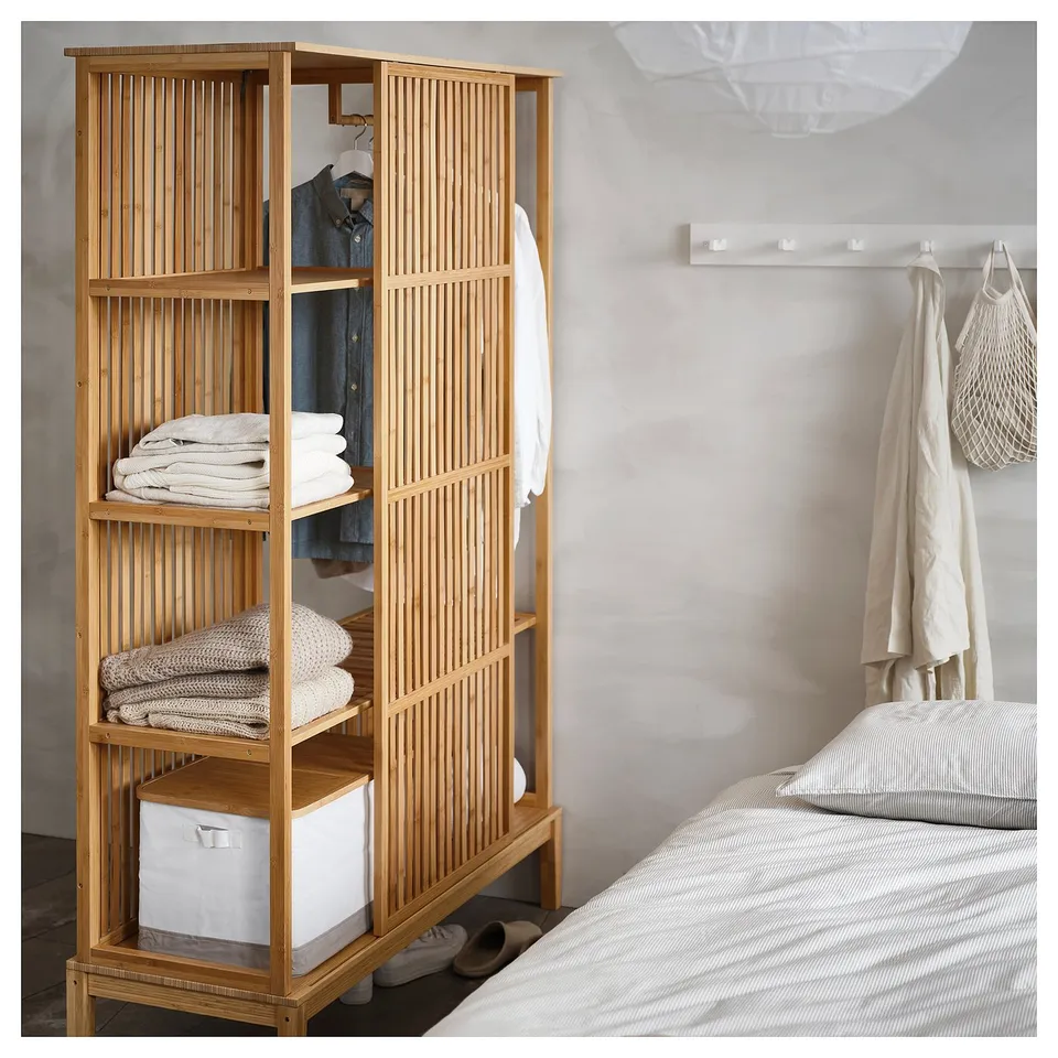 NORDKISA natural bamboo wardrobe, neatly folded clothes, white storage bins, light wood design, modern minimalist.