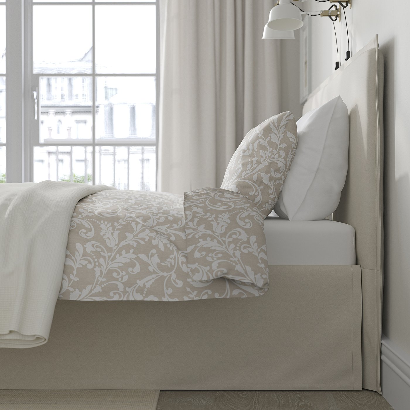 A cosy bed with a padded headboard and removable, washable cover, positioned by a window for natural light and concealing under-bed storage.