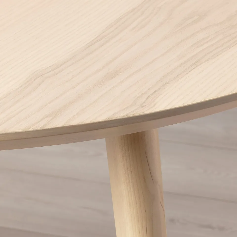 Natural wood table close-up. Smooth ash veneer top, strong birch leg.