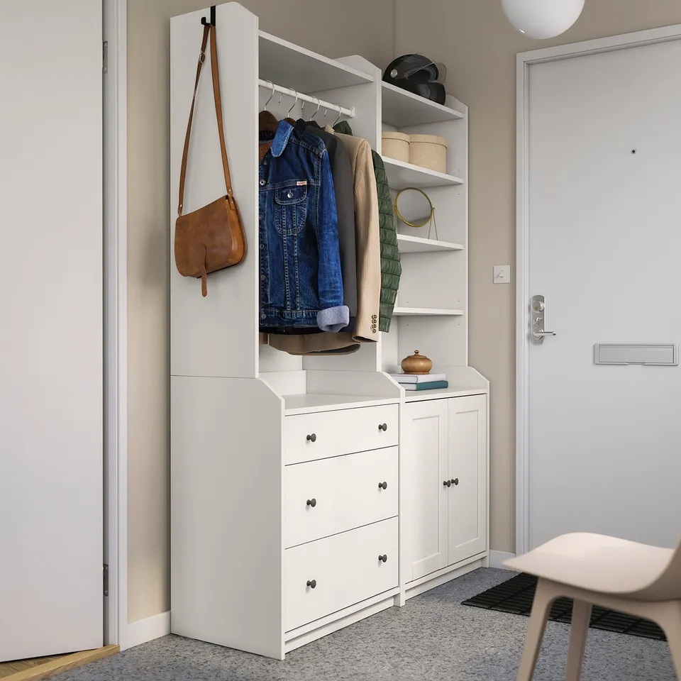 Modern entryway with HAUGA storage, clothes, bag, decor.