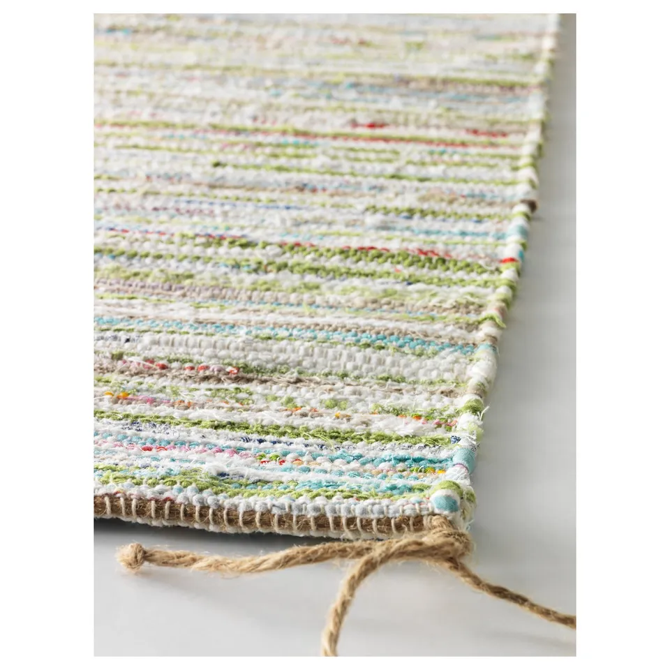 Vibrant, handmade striped rug with various colours. Soft cotton, high quality weave, natural texture.