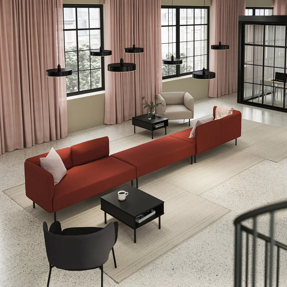 Modern living room with LILLEHEM red couch, black coffee tables, black chair, pink curtains, and black pendant lights.