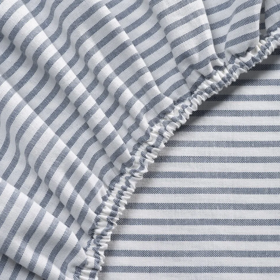 Stripes and patterns on a textured, ruffled fabric. Soft, quality cotton blend.