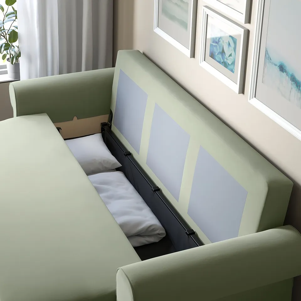 Modern sofa-bed with storage, partially open to reveal pillow inside. Perfect for quick sleep setup and space-saving.
