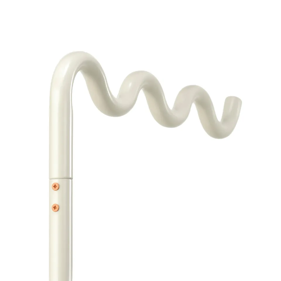 A white metal pole with a decorative, wavy top; sturdy and well-finished.