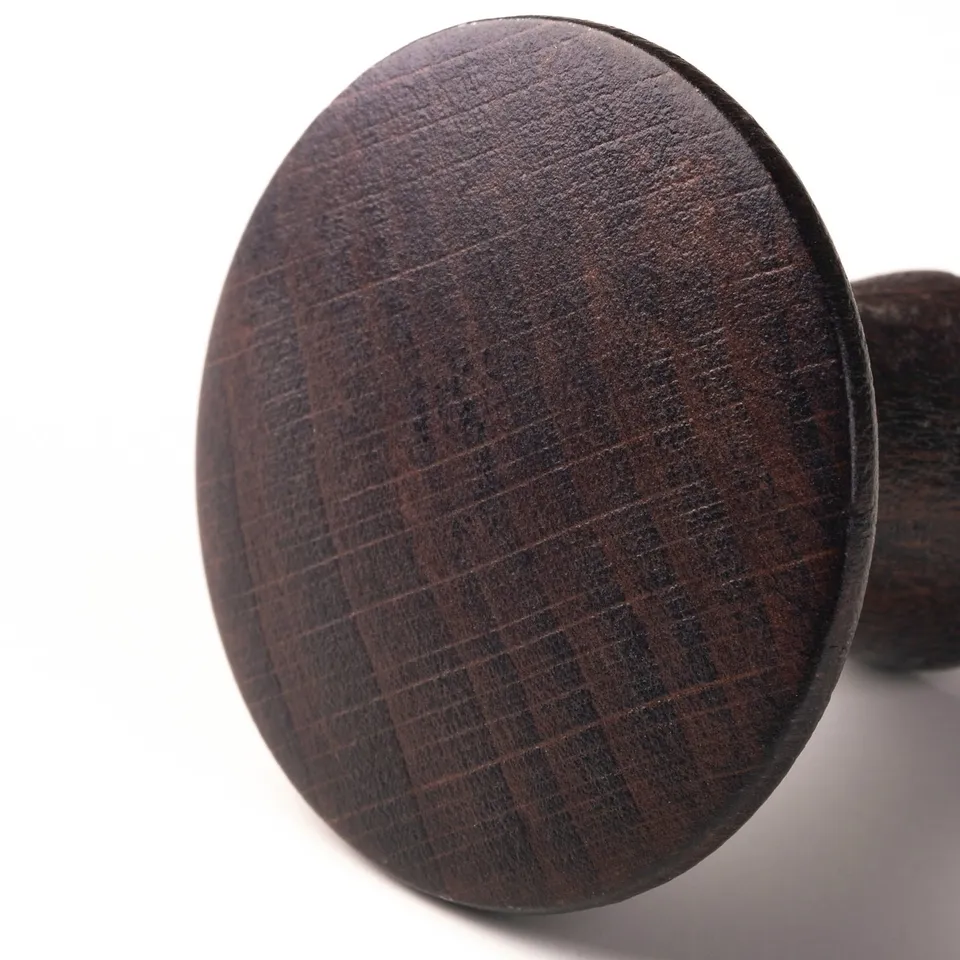 Dark wood round handle, smooth finish for furniture.