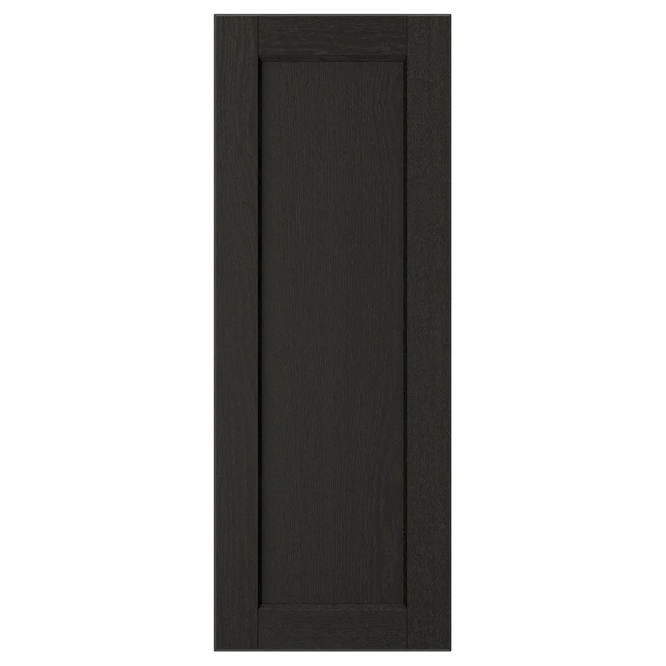 A LERHYTTAN black kitchen cabinet door with a solid wood frame, bevelled edges, and an inset ash veneer panel.