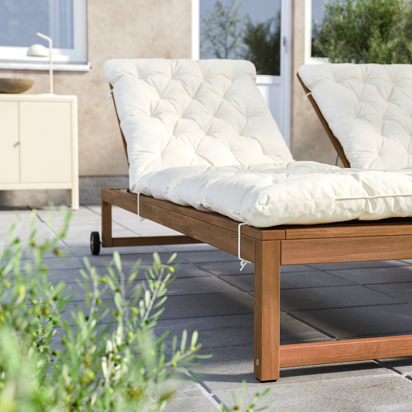 Outdoor furniture set with beige cushions and wooden frames.