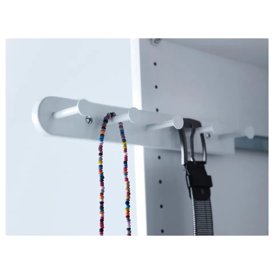 White KOMPLEMENT hanger with colourful beads and black belt.
