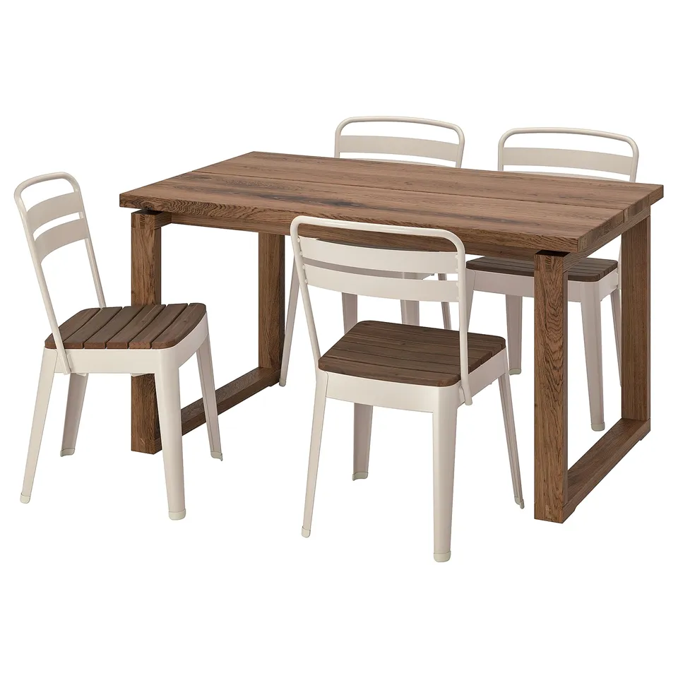 A light brown, square wooden dining table with four matching chairs. The chairs have wooden seats and light beige metal frames.