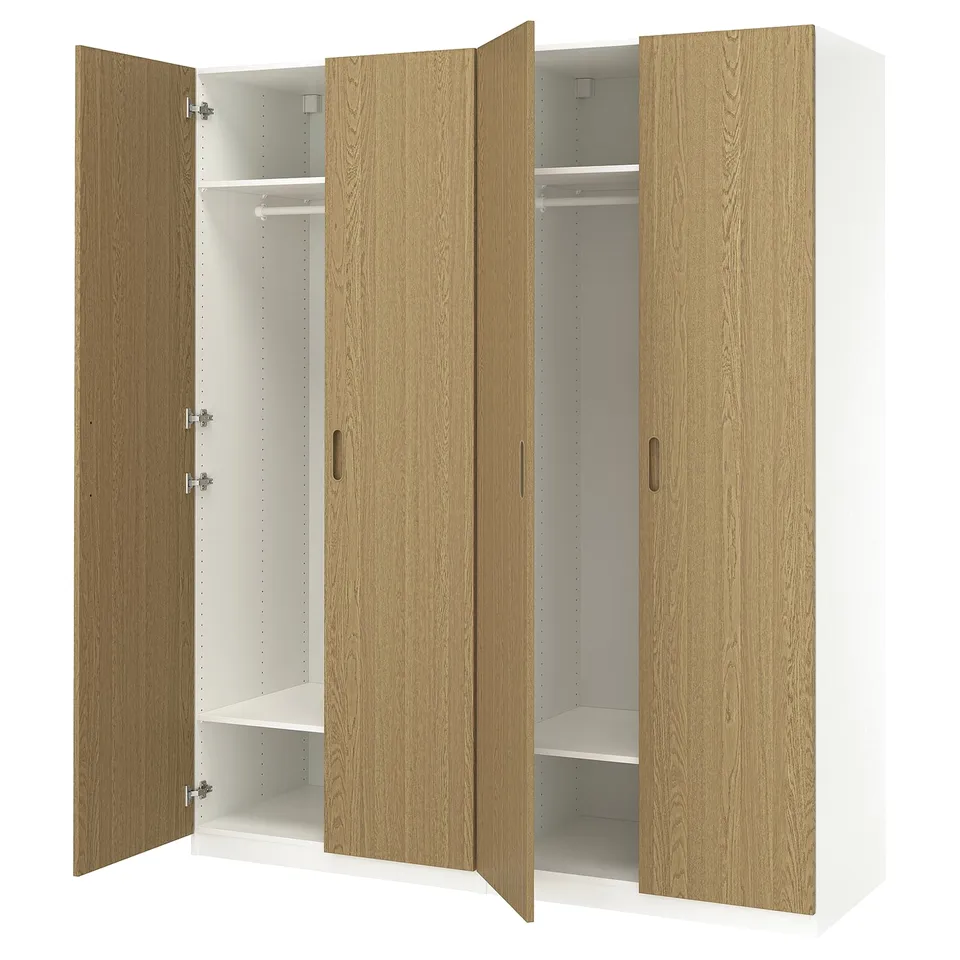 PAX wardrobe: light wood, tall, three sections. Two doors open, one closed.