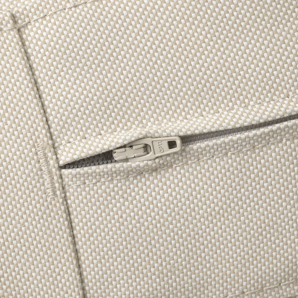 Close-up of a high-quality outdoor sofa zip, showing durable fabric and sturdy construction.