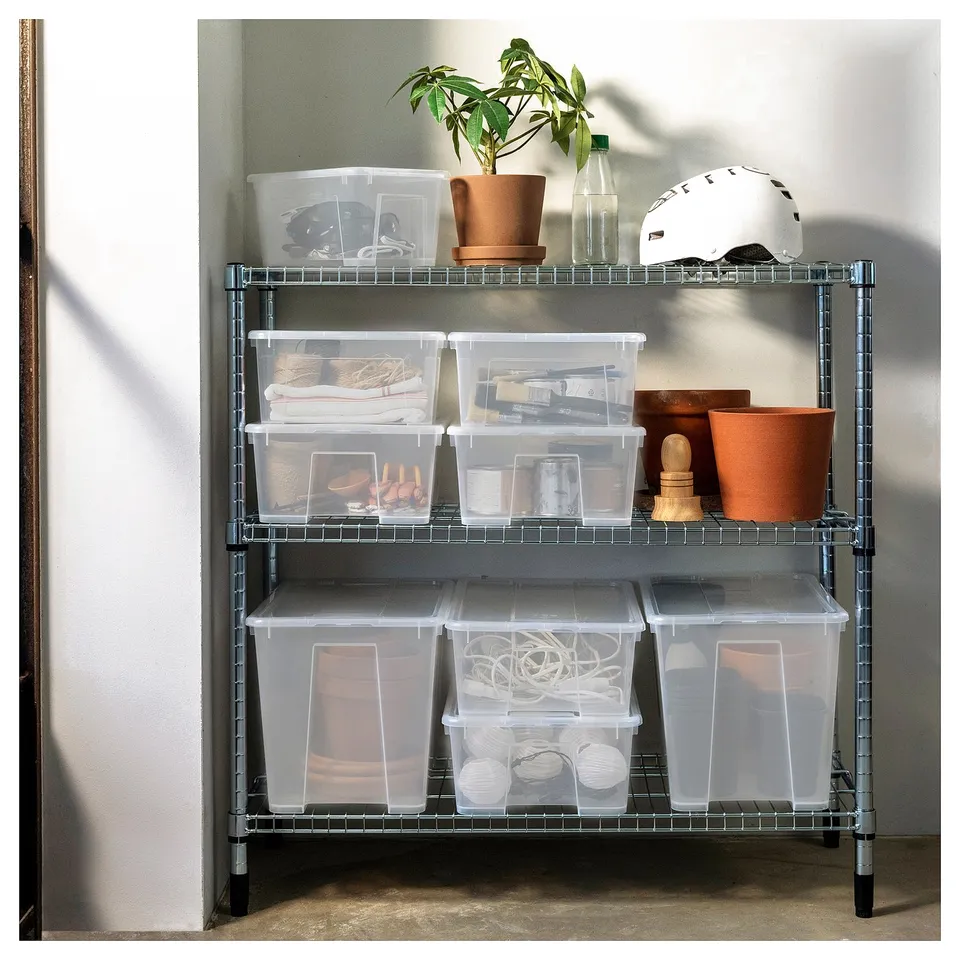 Metal wire rack with plastic bins, plant, hat, misc. Items, varying contents.