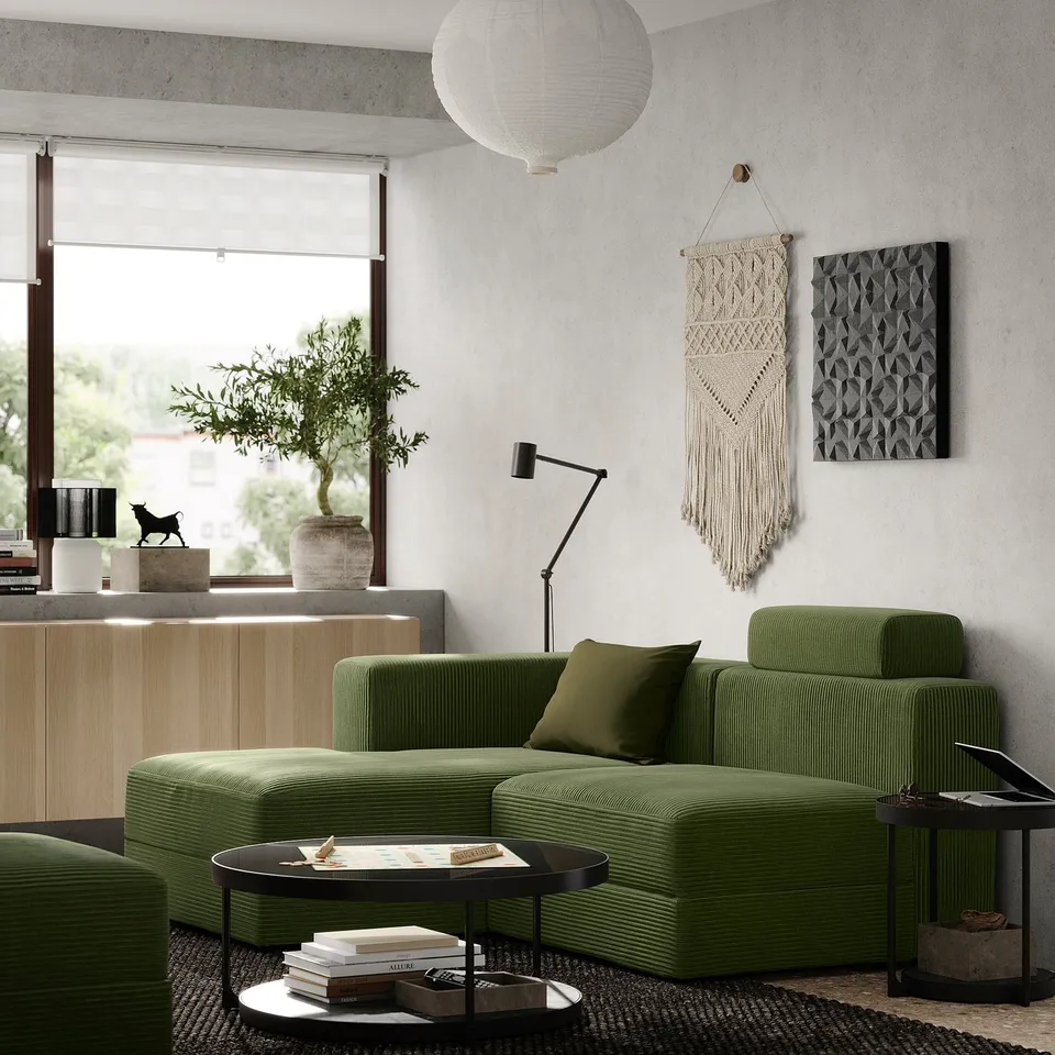 Modern living room with green JÄTTEBO sofa, wall art, and large window.